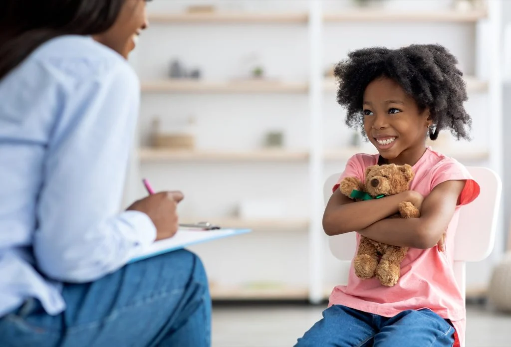 A parent talking to a child about addiction in a supportive and calm environment