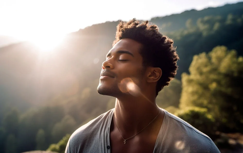 man with face toward the sun happy and in recovery
