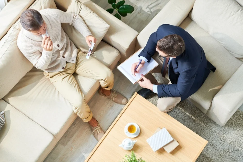 birdseye view of male therapist and his patient in therapy session