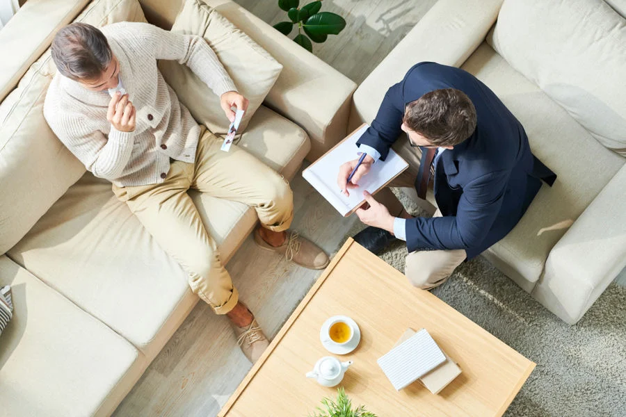 Therapist supporting patient during addiction treatment where gabapentin may be used to reduce alcohol cravings.