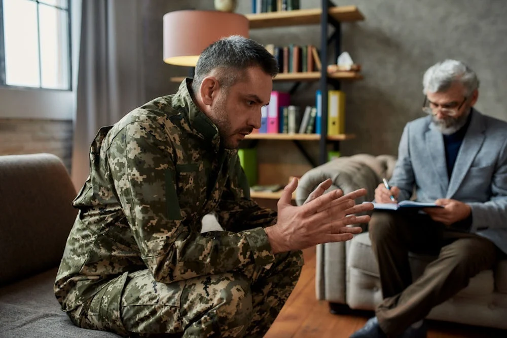 substance-abuse-treatment-for-veterans a veteran in therapy session at rehab for veterans