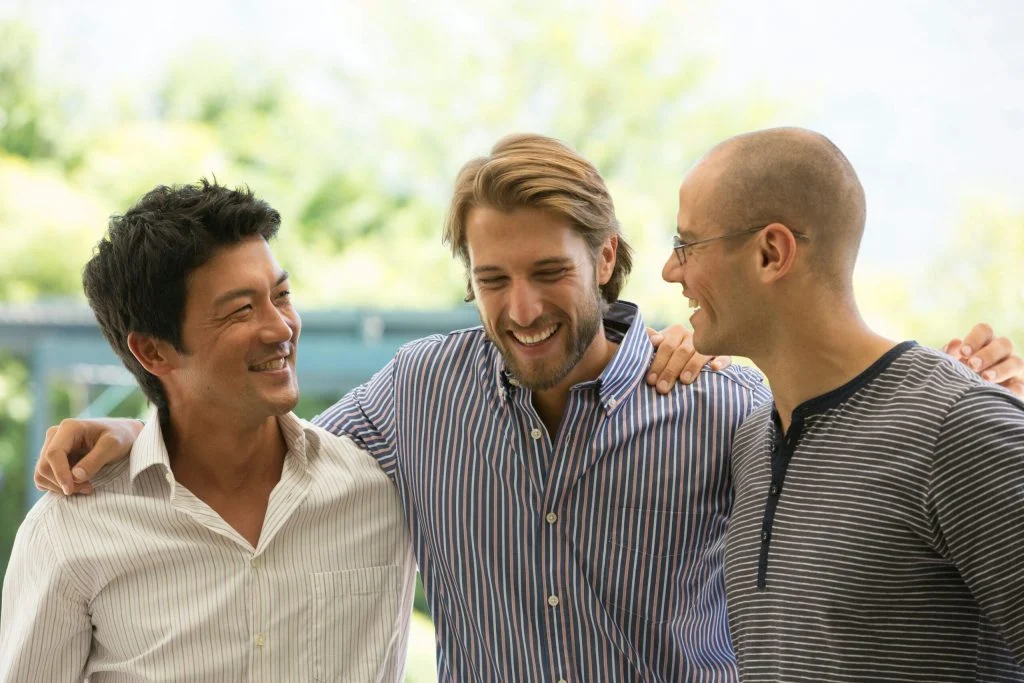 Three friends sharing a moment together.