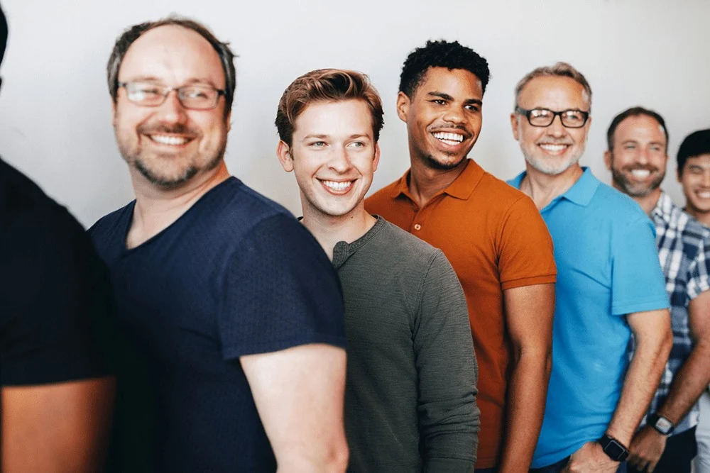 Group of men from a recovery support group, finding strength in community.