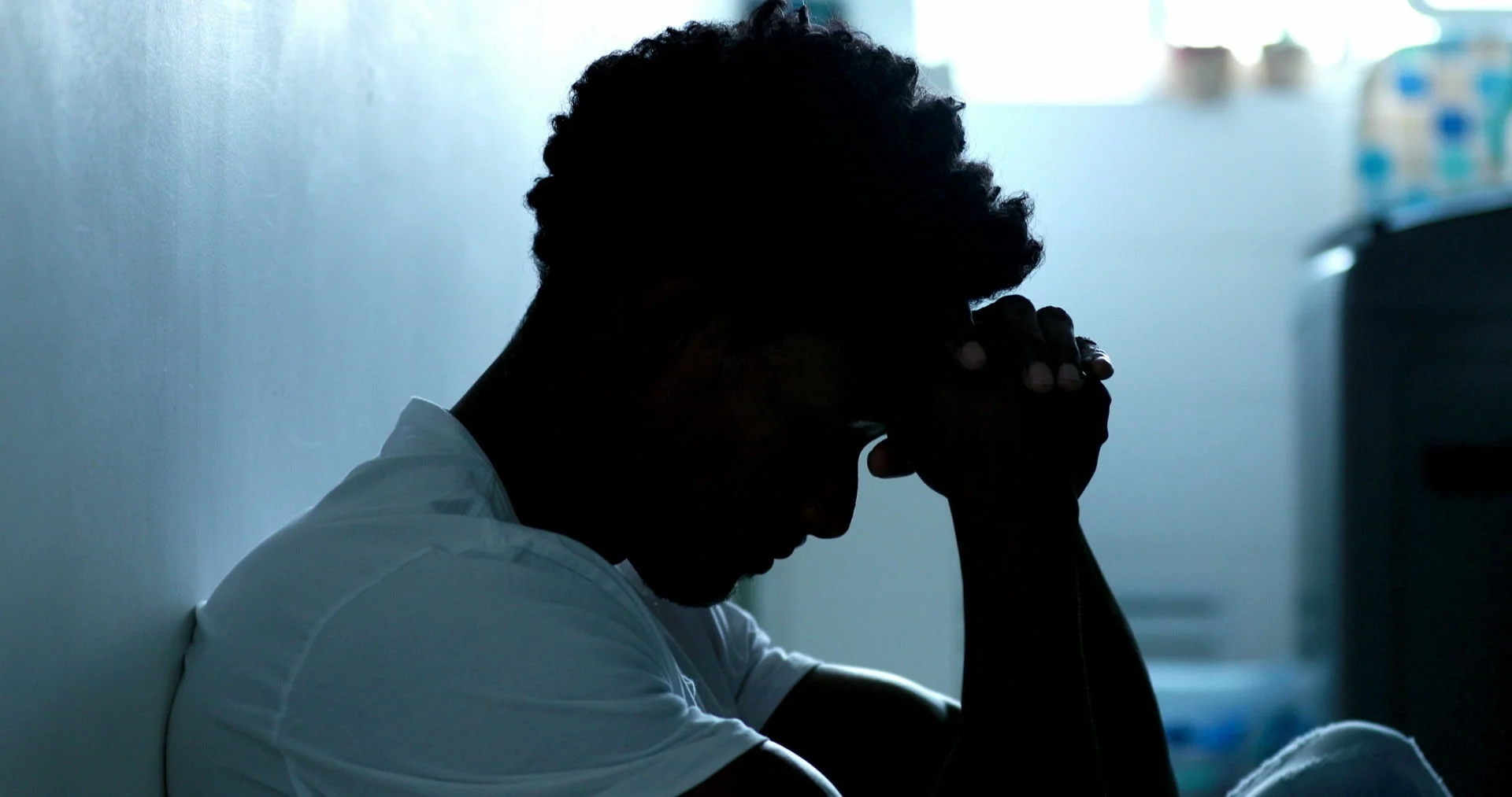Unemployed man coping with depression and isolation after job loss.