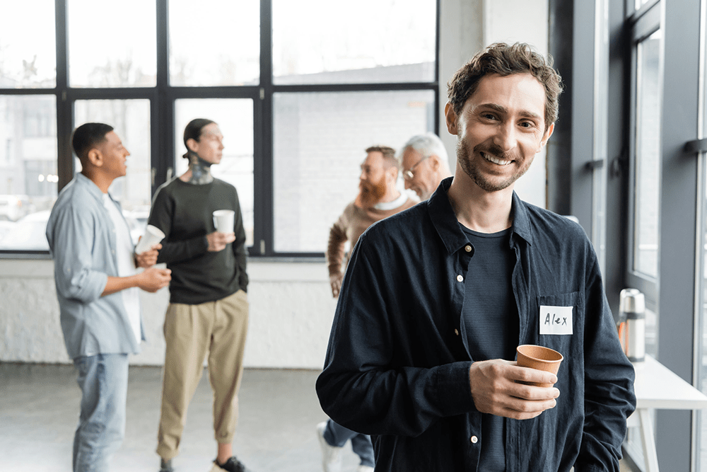 Men supporting each other in group therapy, highlighting the power of community-based addiction treatment.