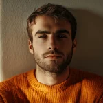 Lonely man sitting alone, symbolizing male loneliness and its link to addiction.