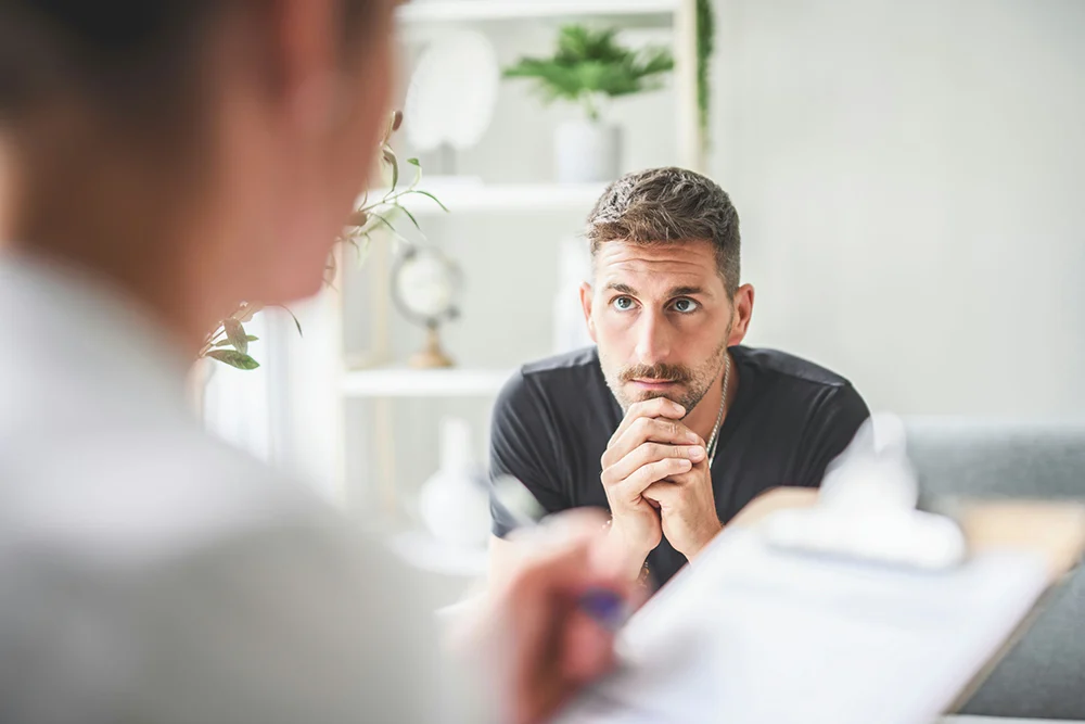 man in counseling for alcohol abuse learning about sobriety