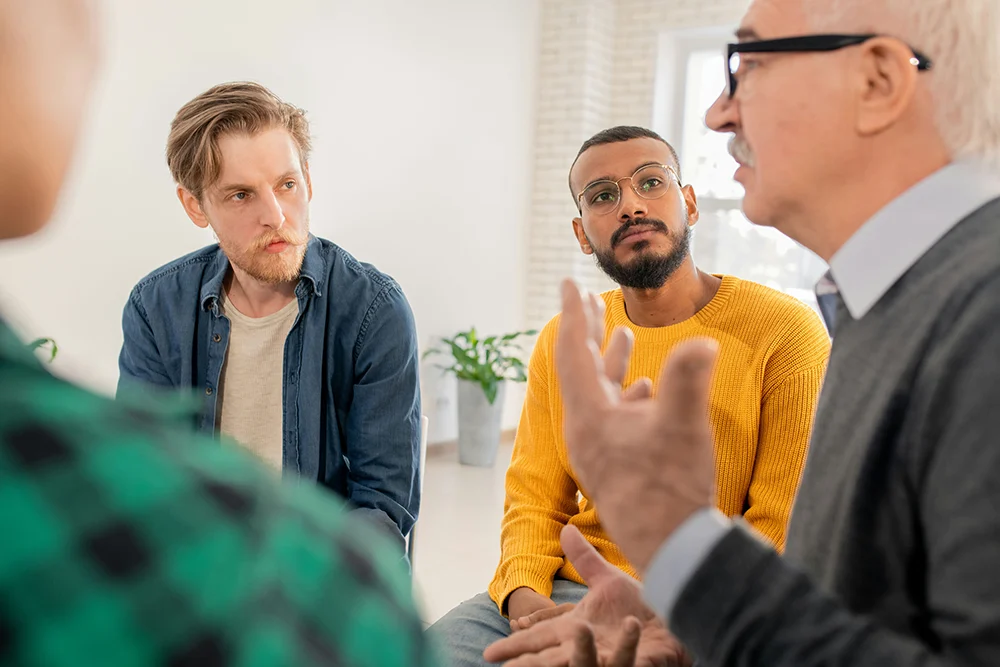 men supporting one another during group therapy session at Spero Recovery near Vail, CO