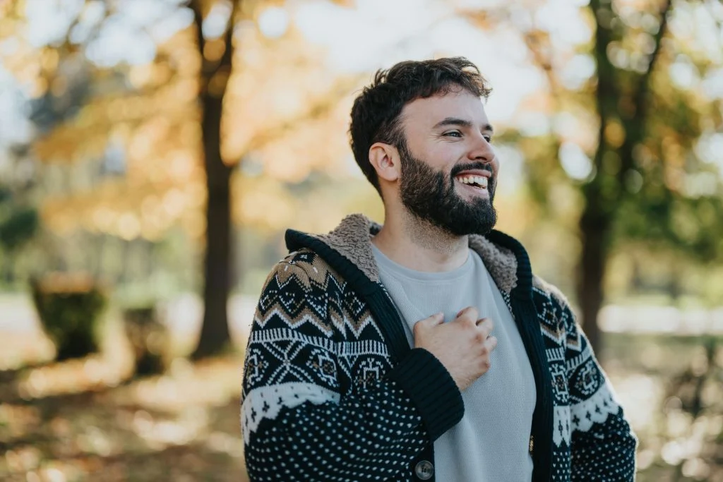man on a scenic forest trail in Evergreen, Colorado, used to support mindfulness and outdoor therapy during addiction treatment.