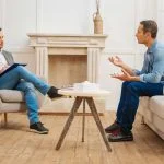 man speaking with a licensed therapist during a private addiction counseling session