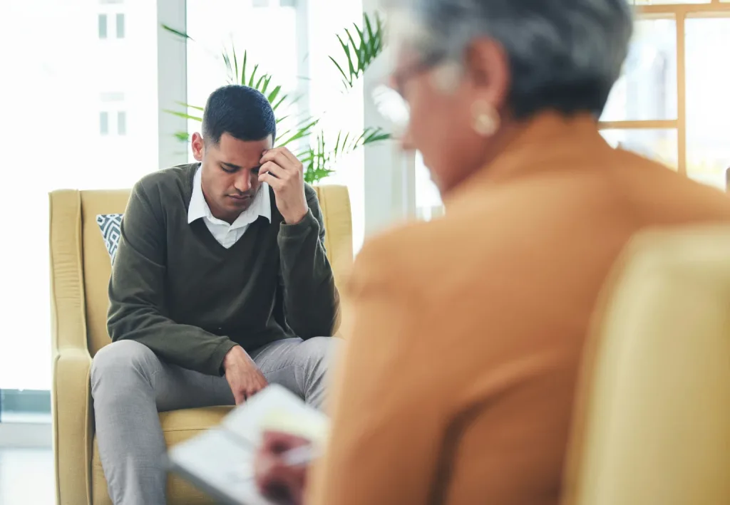 fentanyl-rehab-center-colorado man in individual therapy discussing fentanyl addiction recovery with a counselor