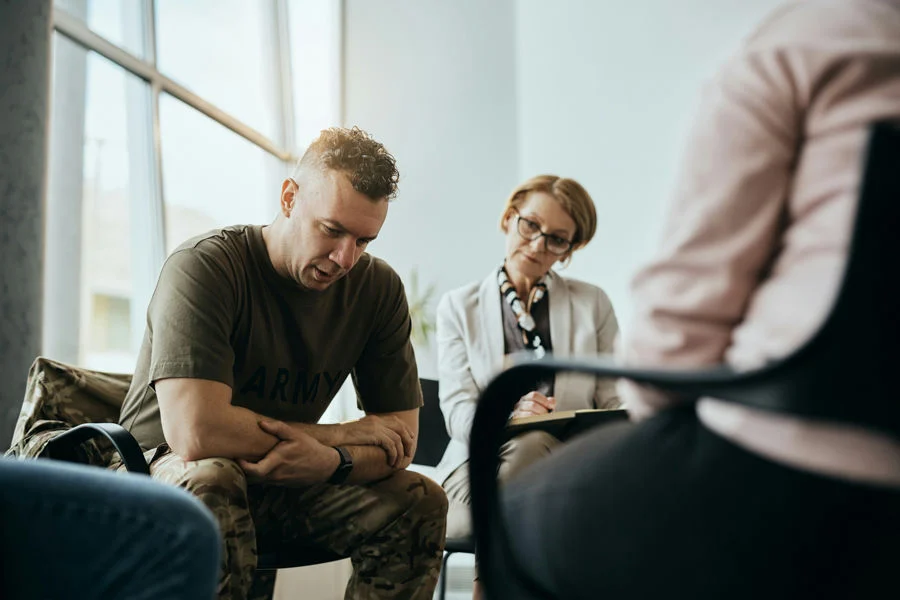 Men attending residential drug rehab and group therapy for addiction recovery