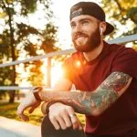 adult man outside at sunrise reflecting on healing from the lasting effects of growing up with an alcoholic parent.