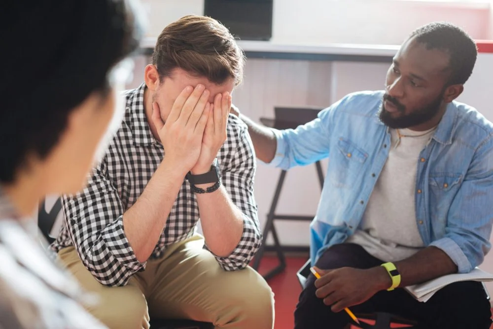 man comforted after not receiving rehab visits