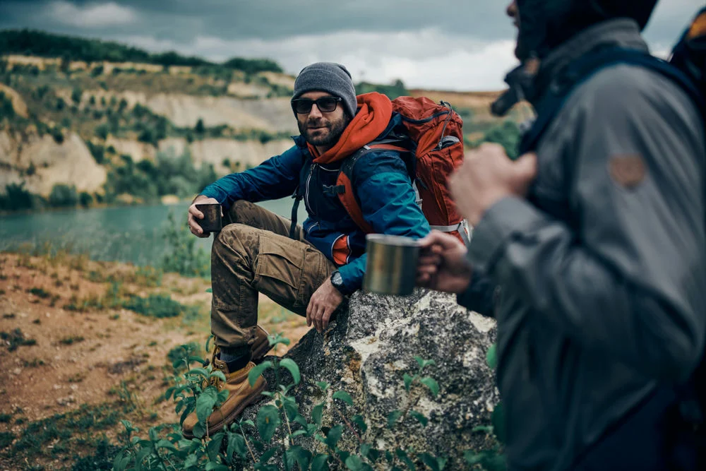 two men hiking as part of experiential therapy