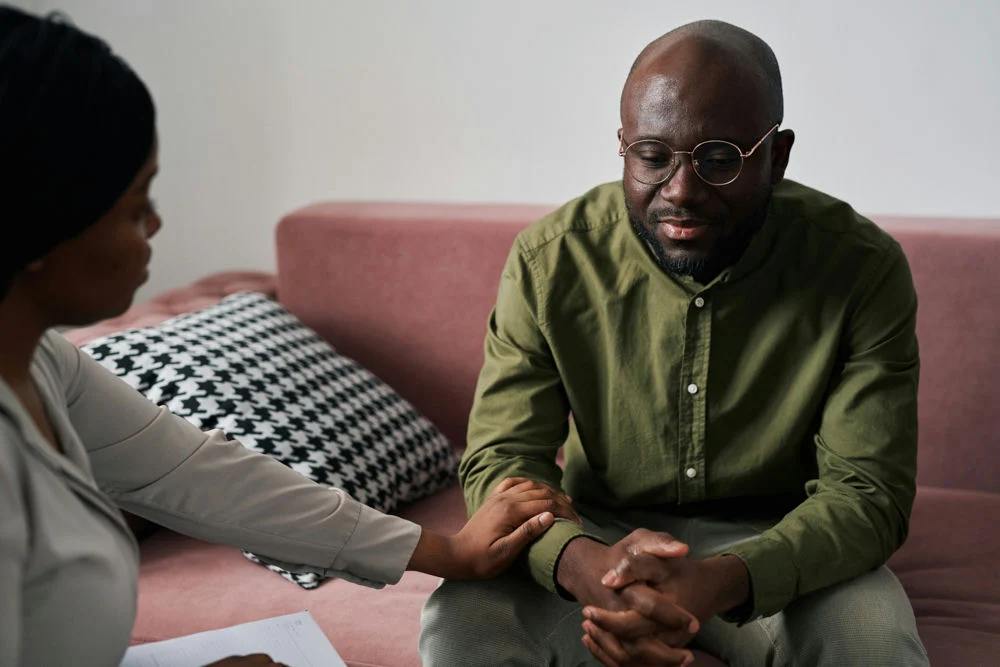 Therapist explaining the importance of self-forgiveness in 12-step programs to her patient