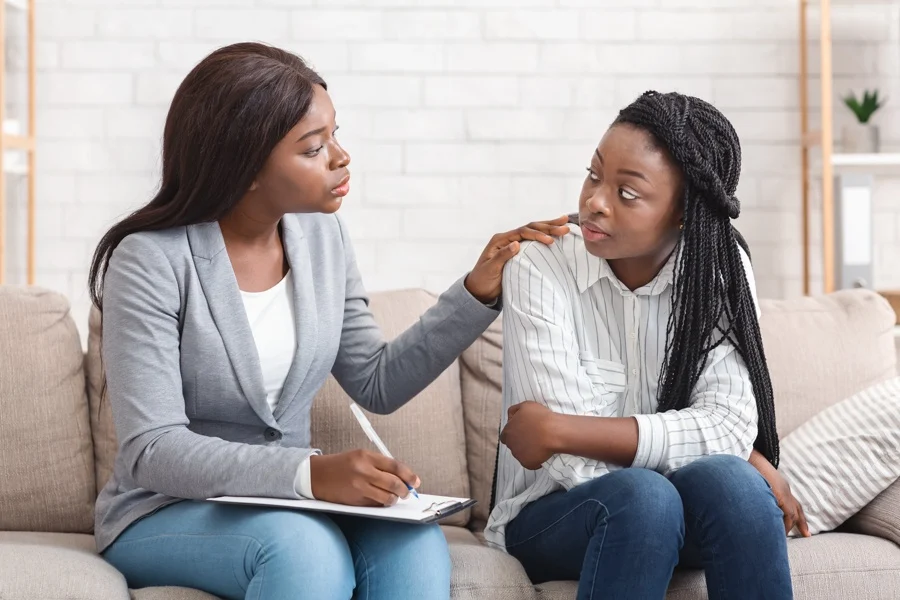 Introverted person engaging in a recovery alumni community through small group support