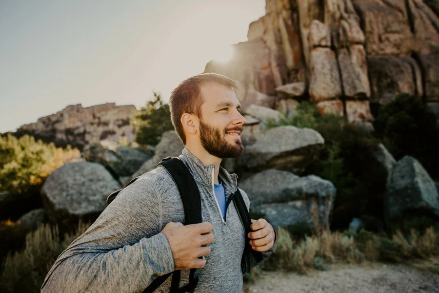 Man walking a trail at sunrise, representing brain healing and recovery from addiction.