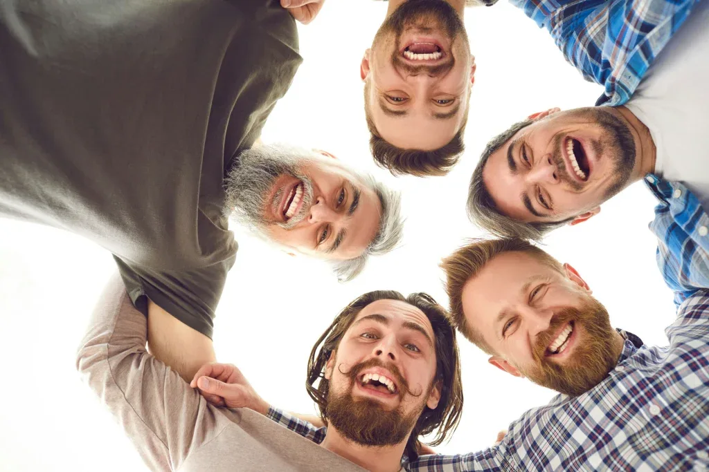 group of men in recovery supporting each other through addiction and bipolar treatment