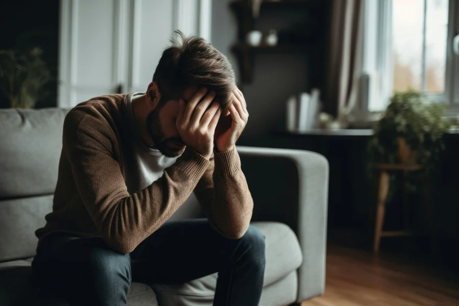 Young man struggling with substance use disorder and mental health challenges