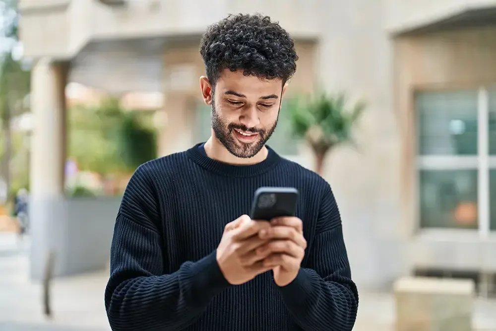 person making a confidential phone call to begin addiction treatment