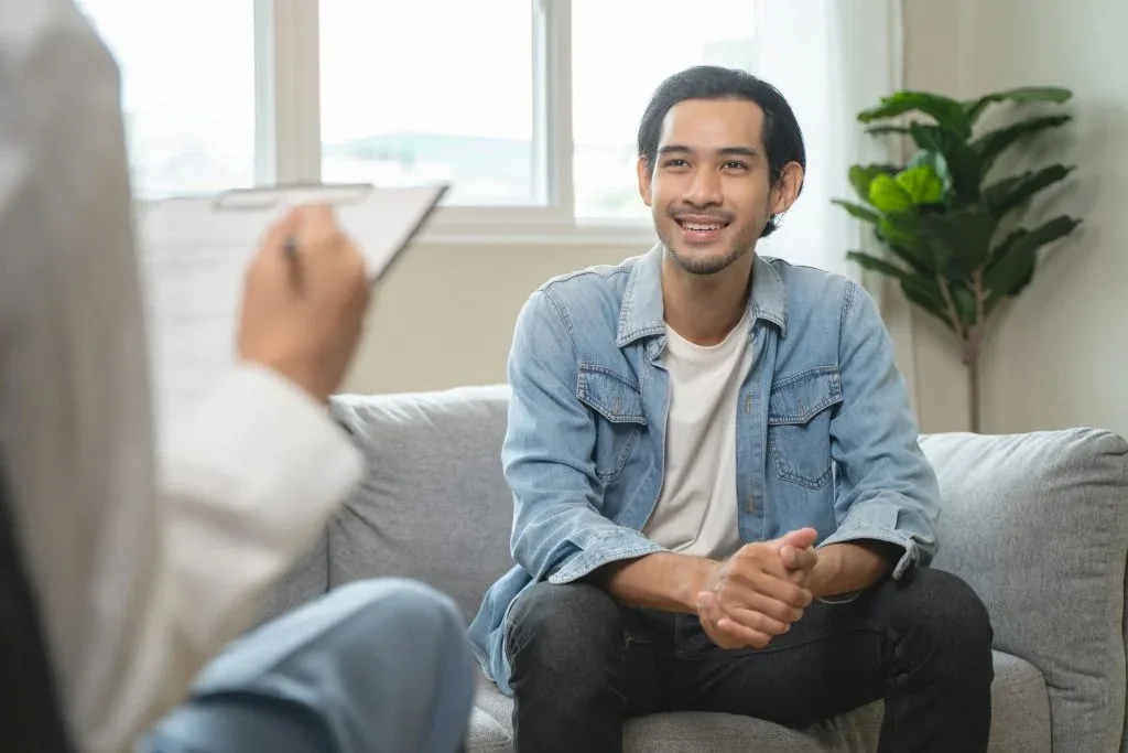 Therapist guiding supportive intake at rehab treatment center