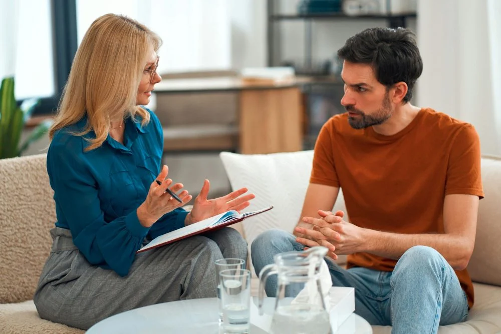 individual therapy session for men beginning addiction recovery
