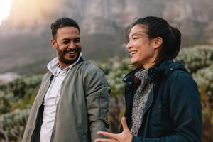 couple smiling outside together