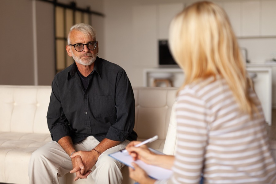 man speaking with sponsor and working 12 steps