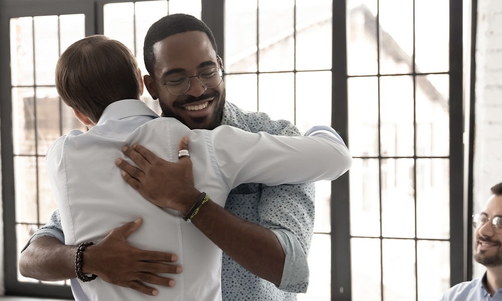 two men hugging