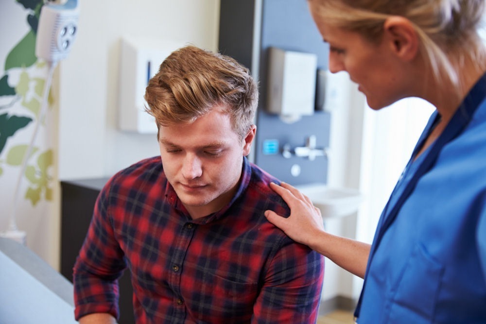 man with a nurse during medical detox