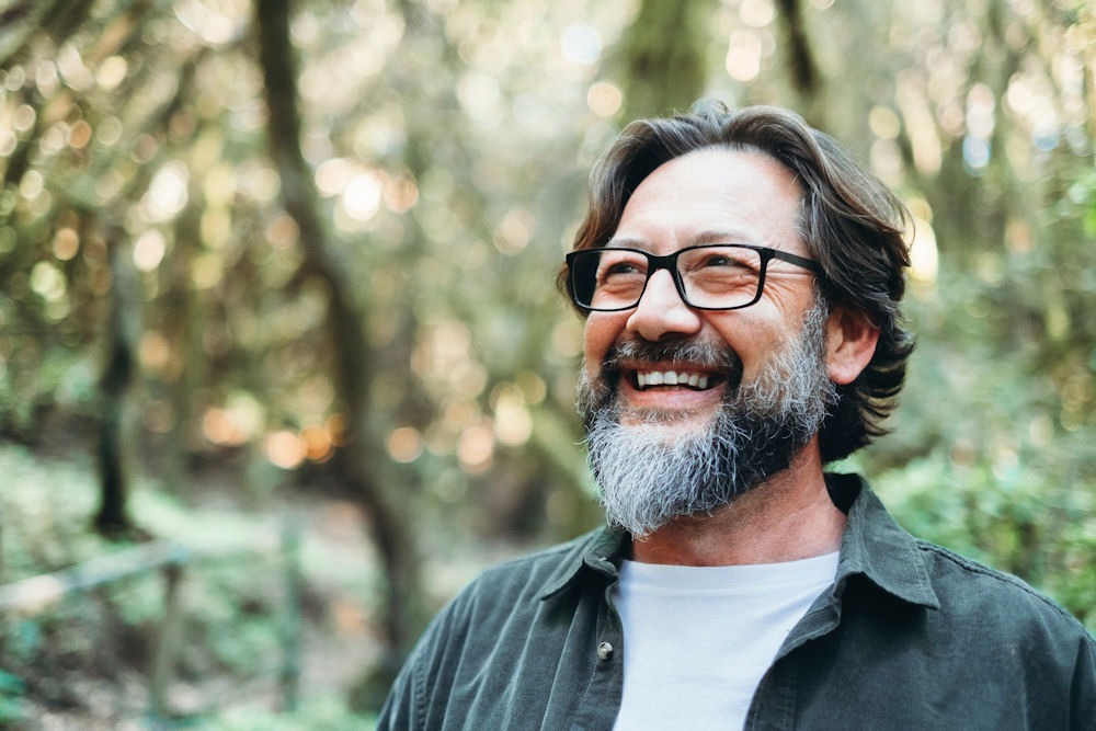 a man smiling at an addiction recovery program